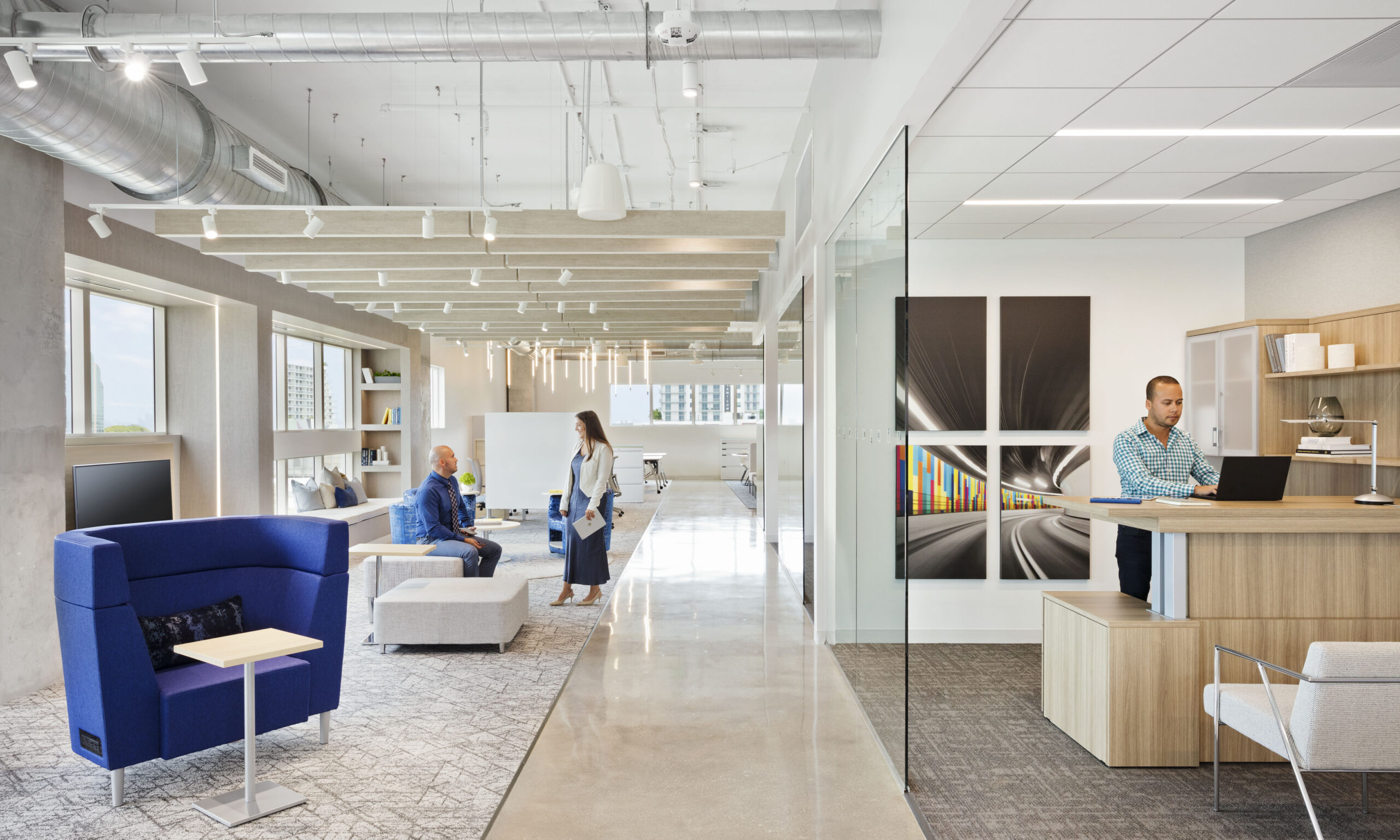 Modern office furniture arrangement highlighting desks chairs and cabinets for workspace design